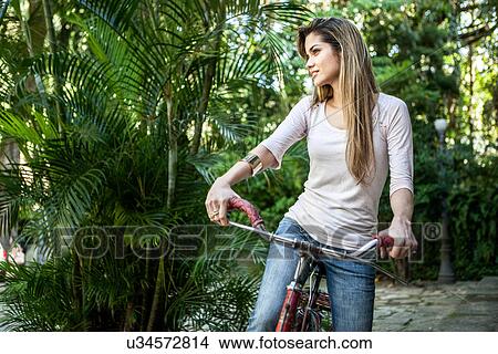 Young woman with bicycle, Rio de Janeiro, Brazil View Large Photo Image Picture - Young woman with bicycle, Rio de Janeiro, Brazil. Fotosearch