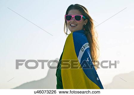 Young woman wrapped in Brazilian Flag View Large Photo Image Stock Photograph - Young woman wrapped in Brazilian Flag. Fotosearch