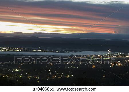 Stock Photography - Aerial view of downtown during sunset. Fotosearch