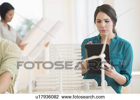 Architects working in office View Large Photo Image Stock Image - Architects working in office. Fotosearch