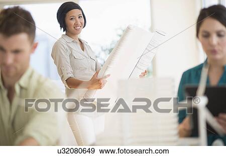 Architects working in office View Large Photo Image Stock Photo - Architects working in office. Fotosearch