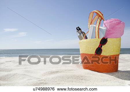 Beach bag with accessories View Large Photo Image Stock Photograph - Beach bag with accessories. Fotosearch
