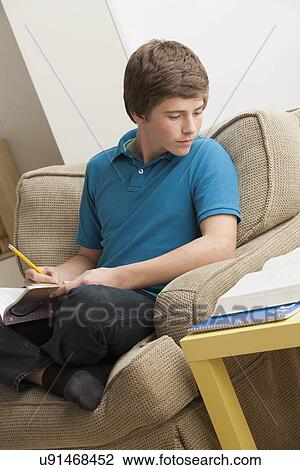 Boy (14-15) studying View Large Photo Image Stock Image - Boy (14-15) studying. Fotosearch