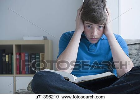 Boy (14-15) tired of studying View Large Photo Image Stock Image - Boy (14-15) tired of studying. Fotosearch