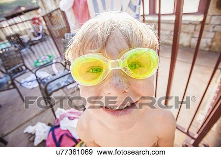 Stock Photo - Boy (4-5) posing in swimming goggles. Fotosearch