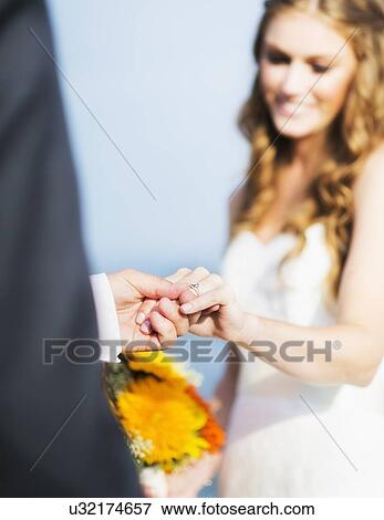 Bride and groom holding hands View Large Photo Image Stock Photo - Bride and groom holding hands. Fotosearch