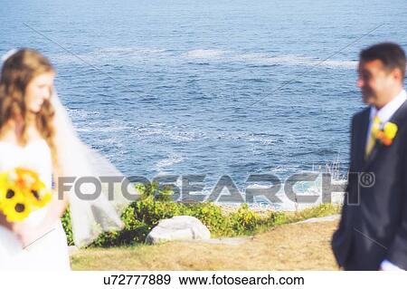 Stock Photo - Bride and groom looking at each other. Fotosearch