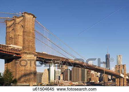 Brooklyn Bridge and cityscape in background View Large Photo Image Stock Photography - Brooklyn Bridge and cityscape in background. Fotosearch