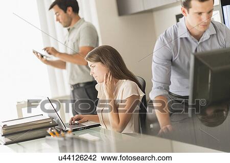 Business people working in office View Large Photo Image Stock Image - Business people working in office. Fotosearch