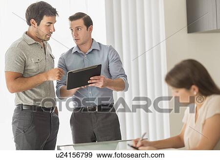 Business people working in office View Large Photo Image Stock Photo - Business people working in office. Fotosearch