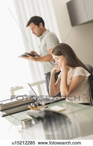 Business people working in office View Large Photo Image Stock Photography - Business people working in office. Fotosearch