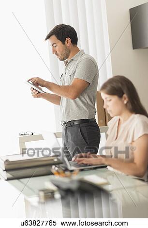 Business people working in office View Large Photo Image Stock Photography - Business people working in office. Fotosearch