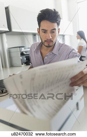 Businessman at work in office View Large Photo Image Stock Image - Businessman at work in office. Fotosearch