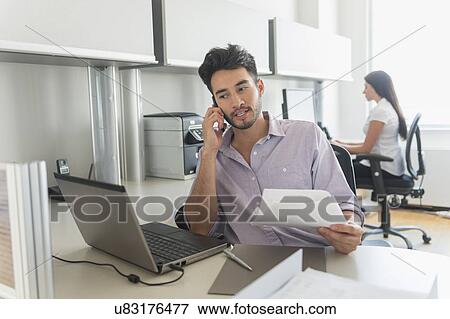 Businessman at work in office View Large Photo Image Stock Photo - Businessman at work in office. Fotosearch