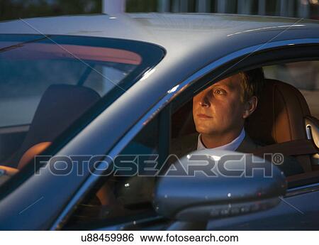 Stock Photograph - Businessman driving car. Fotosearch