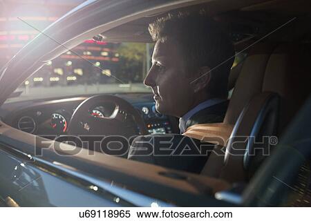 Businessman driving car View Large Photo Image Stock Photography - Businessman driving car. Fotosearch