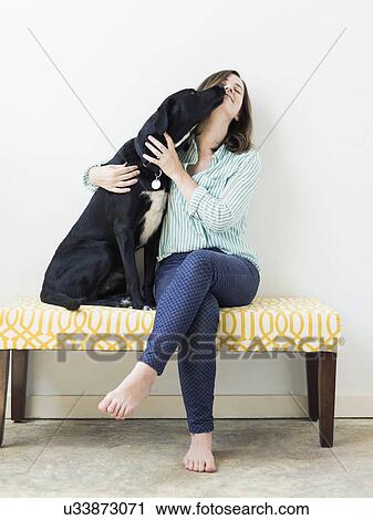 Dog licking woman on face View Large Photo Image Stock Image - Dog licking woman on face. Fotosearch