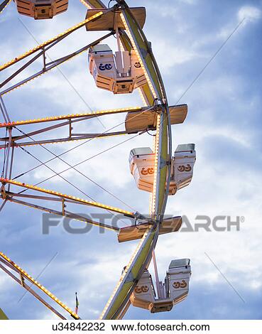 Stock Image - Ferris wheel in amusement park. Fotosearch