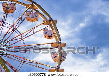 Ferris wheel in amusement park View Large Photo Image Stock Photo - Ferris wheel in amusement park. Fotosearch