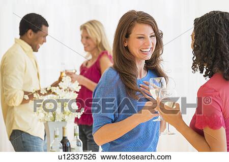 Friends at party View Large Photo Image Stock Photograph - Friends at party. Fotosearch