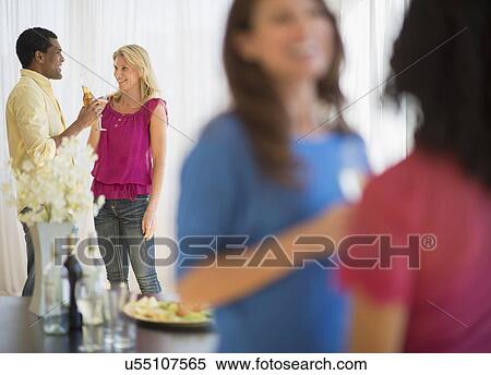 Stock Photography - Friends at party. Fotosearch