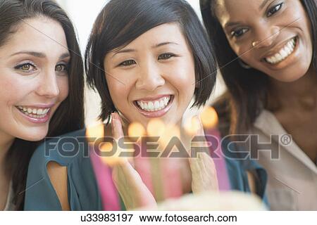Friends celebrating birthday View Large Photo Image Stock Photo - Friends celebrating birthday. Fotosearch