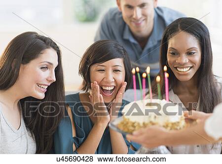 Friends celebrating birthday View Large Photo Image Stock Photo - Friends celebrating birthday. Fotosearch
