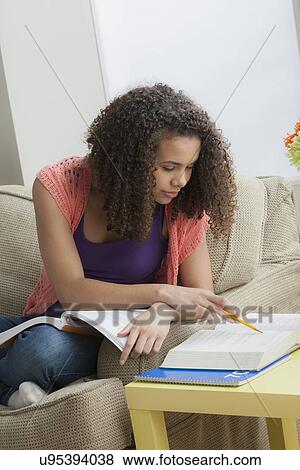 Girl (12-13) studying View Large Photo Image Stock Photo - Girl (12-13) studying. Fotosearch