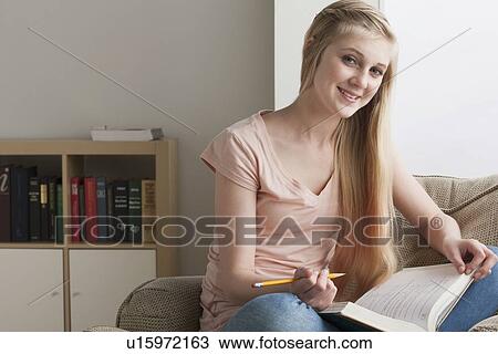 Girl (14-15) studying View Large Photo Image Stock Image - Girl (14-15) studying. Fotosearch