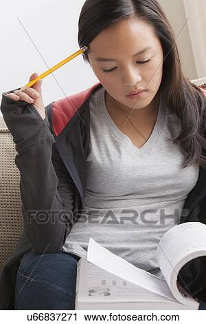 Girl (16-17) studying View Large Photo Image Stock Image - Girl (16-17) studying. Fotosearch