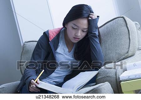 Girl (16-17) studying View Large Photo Image Stock Photo - Girl (16-17) studying. Fotosearch