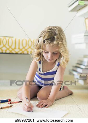 Girl (4-5) sitting on floor and drawing View Large Photo Image Stock Image - Girl (4-5) sitting on floor and drawing . Fotosearch