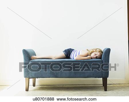 Girl (4-5) sleeping on bench indoors View Large Photo Image Stock Photo - Girl (4-5) sleeping on bench indoors. Fotosearch