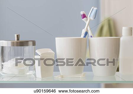 Stock Photograph - His and hers toothbrushes. Fotosearch