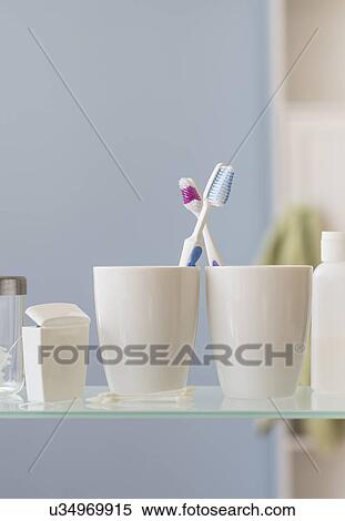 Stock Photography - His and hers toothbrushes. Fotosearch