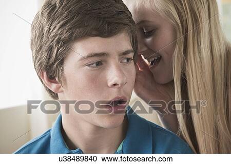 Stock Image - Kids (14-15) gossiping. Fotosearch