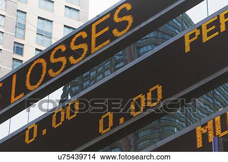 Picture - Low angle view of ticker tape machine. Fotosearch