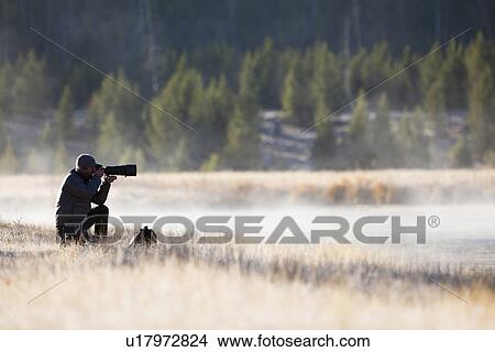 Man photographing nature View Large Photo Image Picture - Man photographing nature. Fotosearch