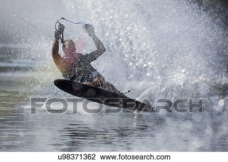 Stock Image - Man waterskiing. Fotosearch