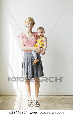 Picture - Mother with baby daughter (12-17 months). Fotosearch
