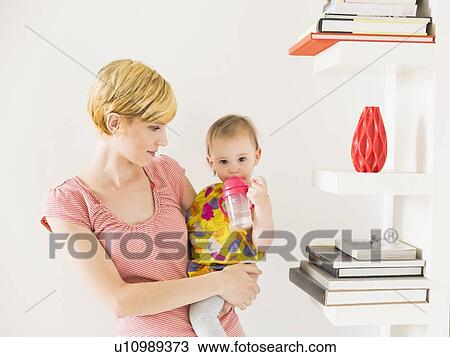 Mother with baby daughter (12-17 months) View Large Photo Image Stock Image - Mother with baby daughter (12-17 months). Fotosearch