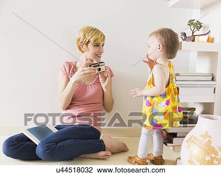 Mother with baby daughter (12-17 months) View Large Photo Image Stock Image - Mother with baby daughter (12-17 months). Fotosearch