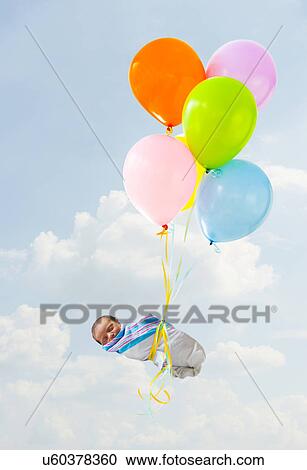 Newborn baby delivered by balloons View Large Photo Image Stock Image - Newborn baby delivered by balloons. Fotosearch