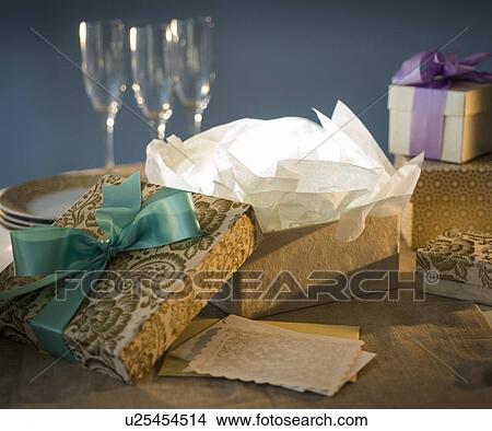 Open gift box and on table View Large Photo Image Picture - Open gift box and on table. Fotosearch