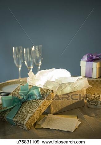 Open gift box and on table View Large Photo Image Stock Photo - Open gift box and on table. Fotosearch