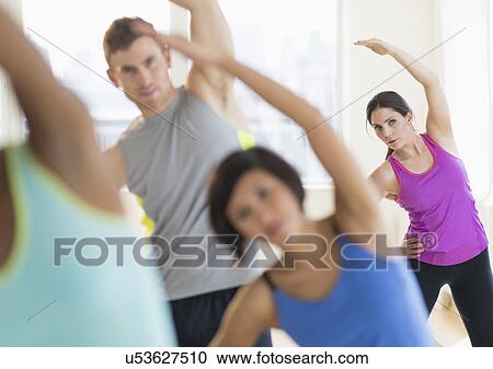 People stretching in gym View Large Photo Image Stock Image - People stretching in gym. Fotosearch