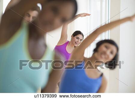 People stretching in gym View Large Photo Image Stock Photo - People stretching in gym. Fotosearch