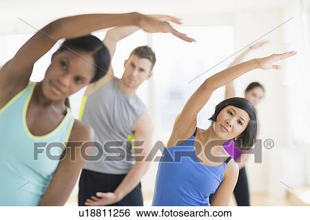 People stretching in gym View Large Photo Image Stock Photograph - People stretching in gym. Fotosearch