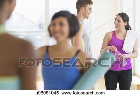 Stock Photography - People talking in gym. Fotosearch