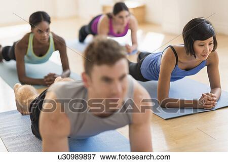 Stock Photo - People training in gym. Fotosearch